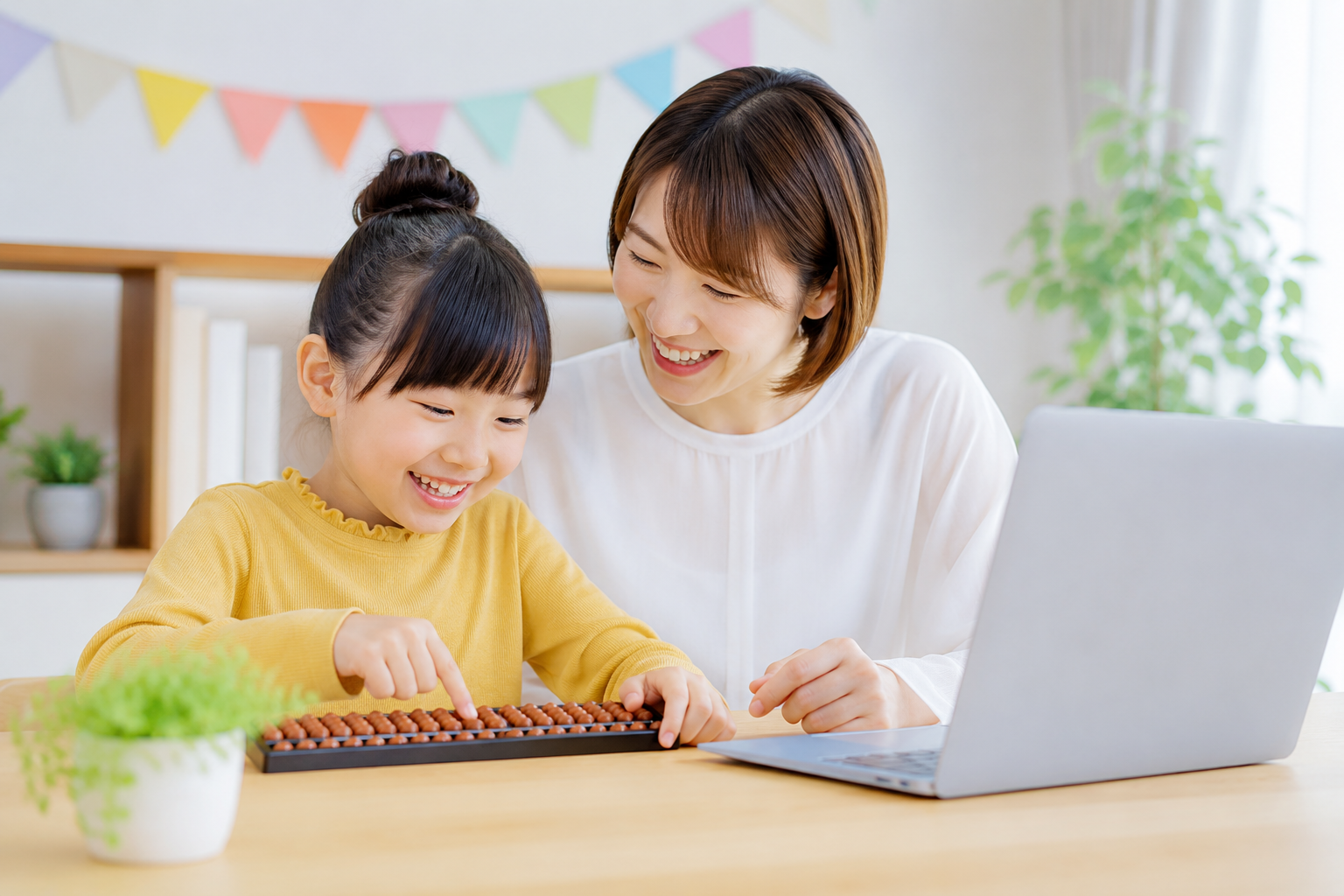 そろばんに取り組む笑顔の子どもとトレーナー